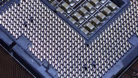 Close-up of bent pins on a motherboard CPU socket – common cause of PC hardware failure